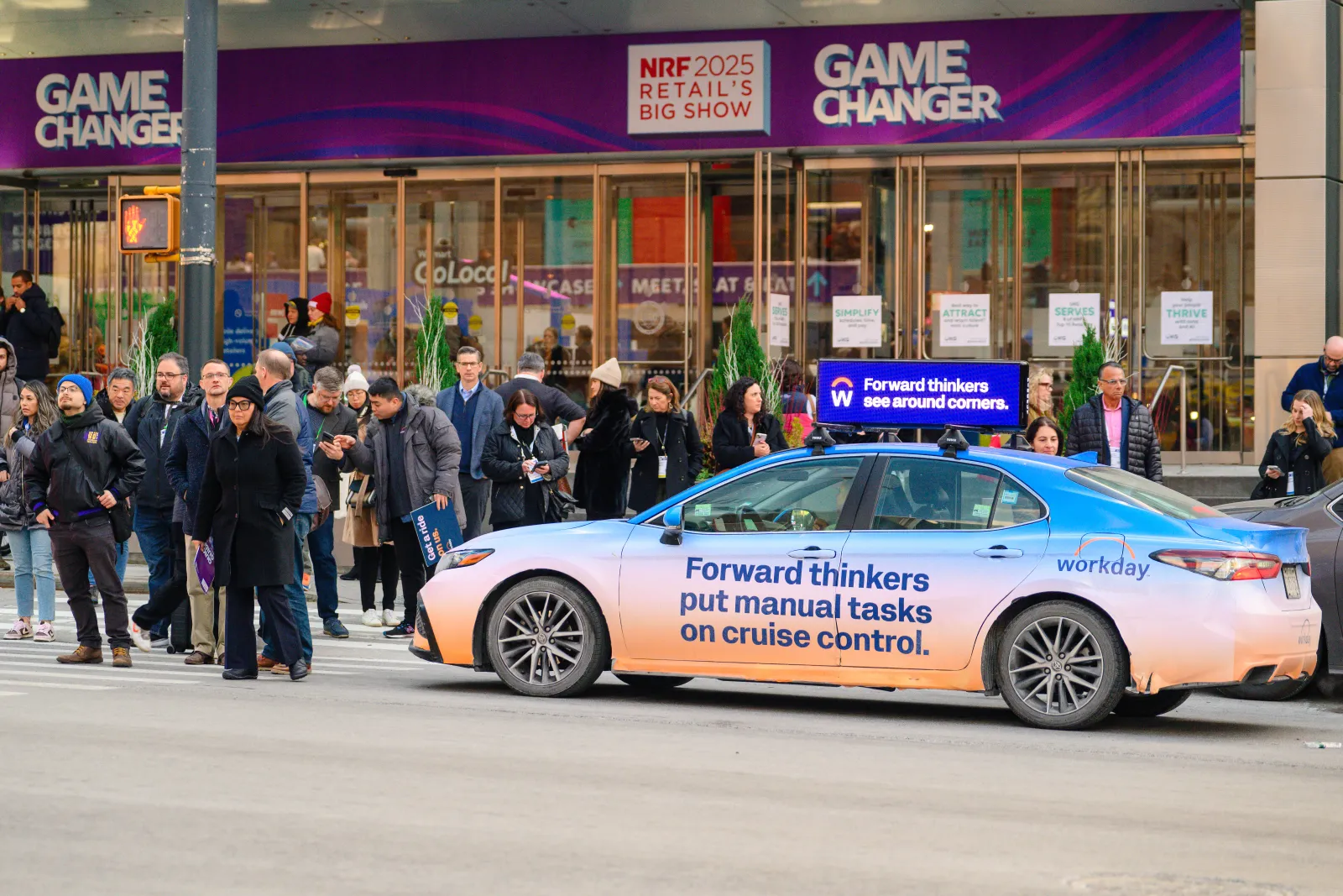 Digital car top display running a Workday campaign on a vehicle in New York City traffic